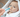 Mom using oogiebear booger picker tool on a newborn baby
