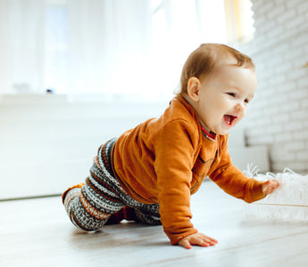 a toddler playing on the floor